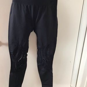 Fabletics black leggings with see through details.